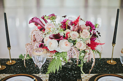 Light pink and maroon floral centerpiece