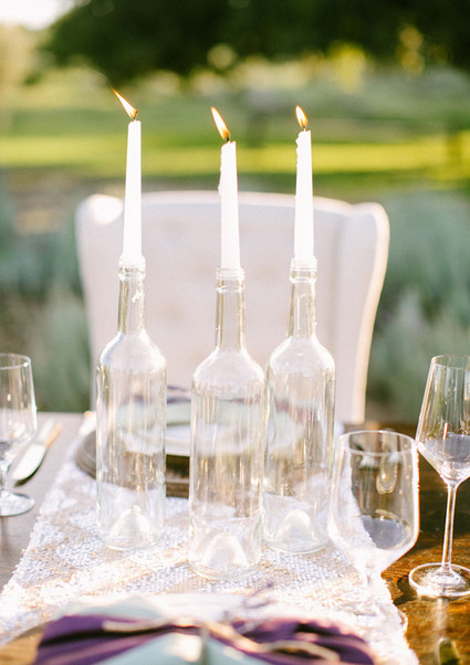 Clear vases with white candles