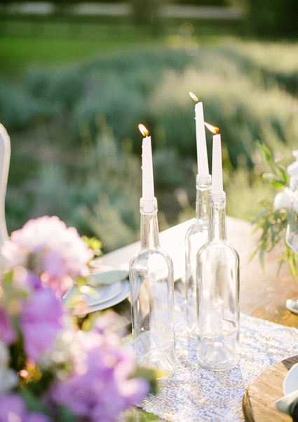 Clear vases with white candles