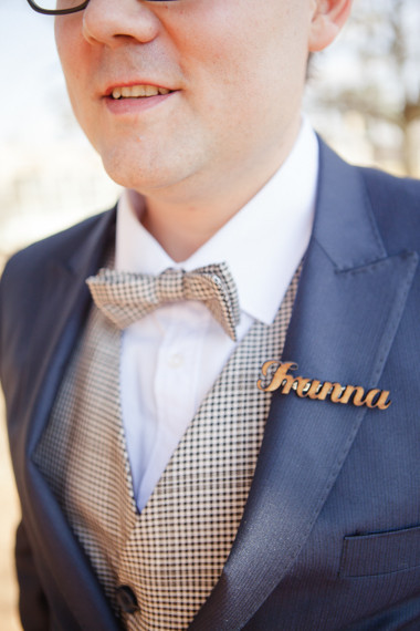 Blue suit with brown bow tie