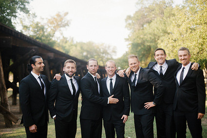 Groomsmen in black suits