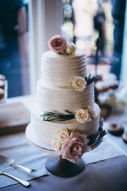 Elegant wedding cake with rose accent