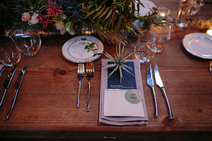 Wooden tablescape with grey and blue place setting