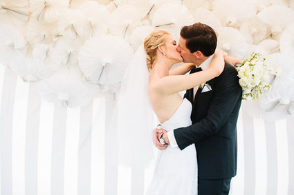 Wedding portraits with white backdrop