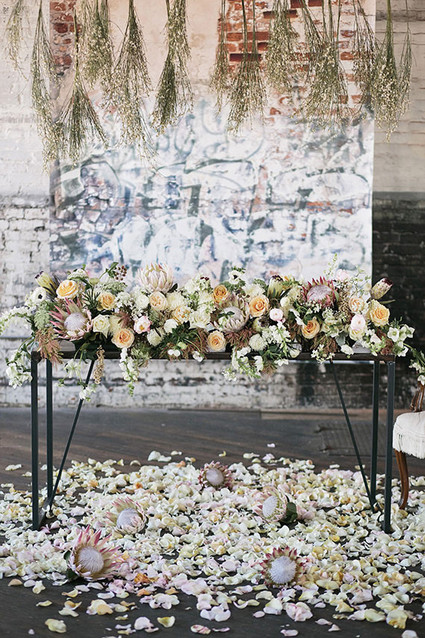 Industrial Wedding Sweetheart Table Protea Decor Inspiration