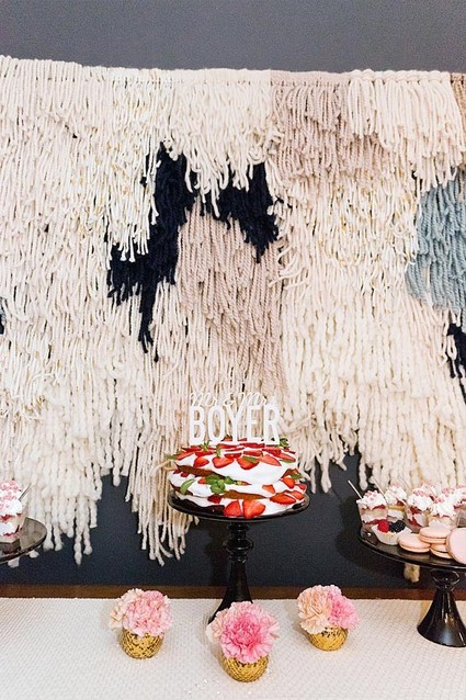 Dessert table with fringe backdrop
