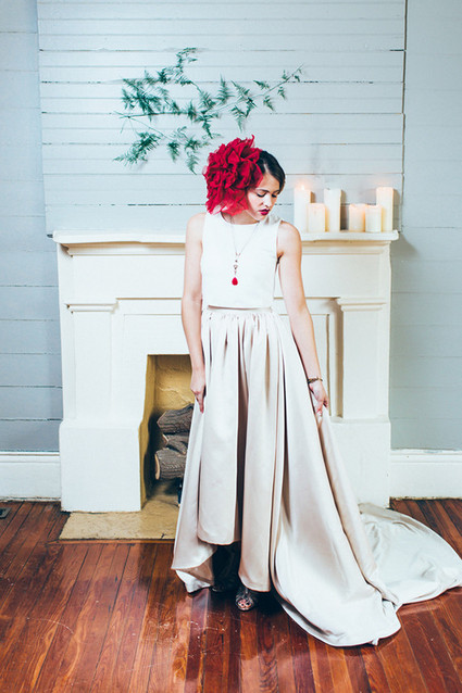 Bride with giant red flower hairpiece