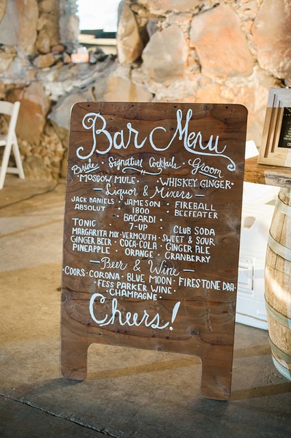 Wooden bar menu with white calligraphy