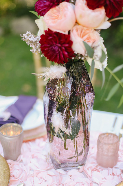 Colorful plum flowers with feather accents
