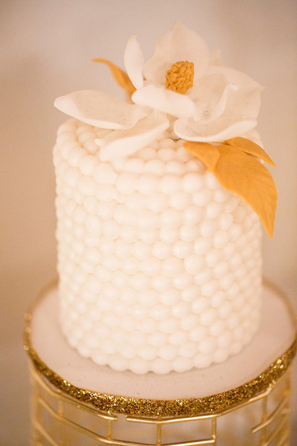 Gold cake with floral topper