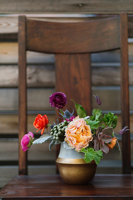 Floral centerpiece with gold vase Inspiration