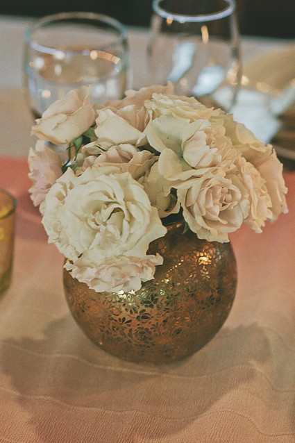 Gold vase with white flowers