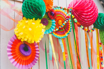 streamers and honeycomb poufs