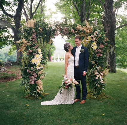 Lush floral ceremony arbor