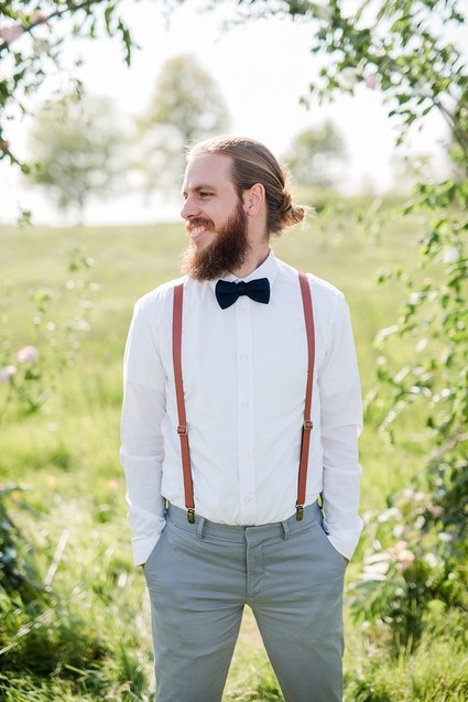 groom with suspenders
