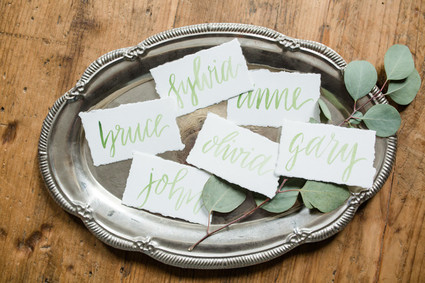 green calligraphy place cards