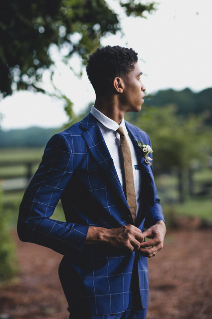 Stylish groom in a blue suit