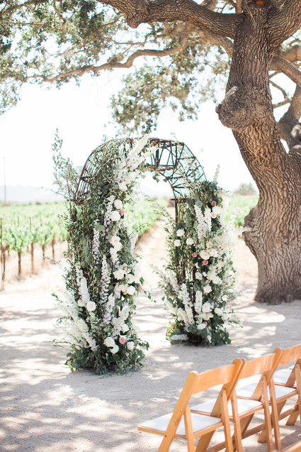 White and green floral arch