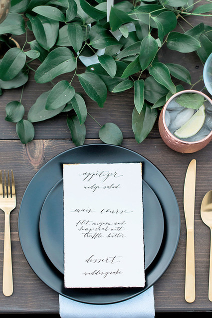 Black and gold place setting