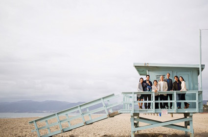 multi generation family photos at the beach