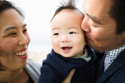 multi generation family photos at the beach