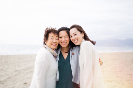 multi generation family photos at the beach