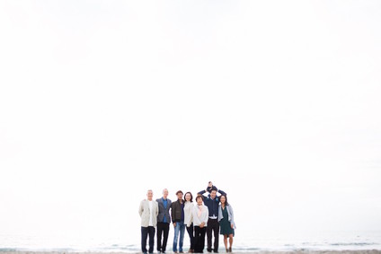 multi generation family photos at the beach