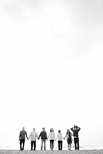 multi generation family photos at the beach