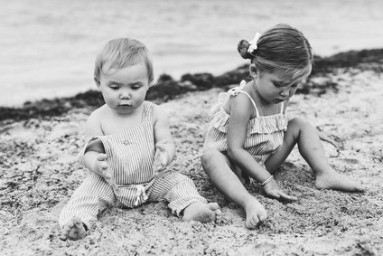 Summery matching sibling photos on the beach