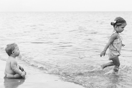 Summery matching sibling photos on the beach