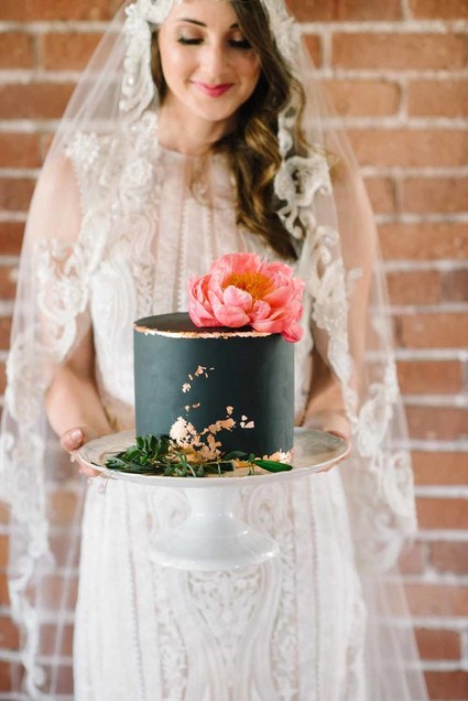 black wedding cake with coral peony