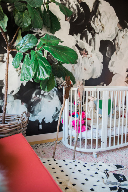 modern girl's nursery with floral wallpaper