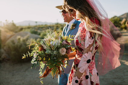 Rustic Joshua Tree wedding with a pink floral dress