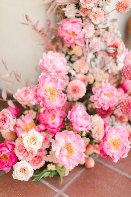 Colorful modern wedding with a killer tropical floral installation