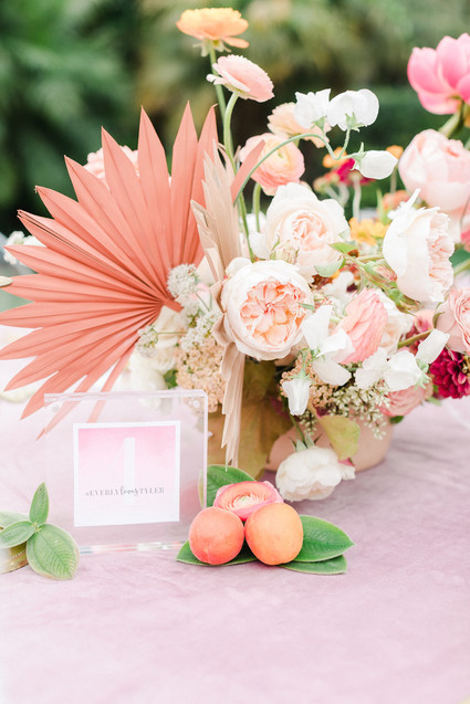 Colorful modern wedding with a killer tropical floral installation