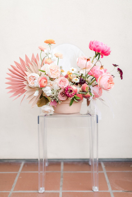 Colorful modern wedding with a killer tropical floral installation