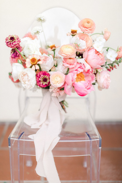 Colorful modern wedding with a killer tropical floral installation