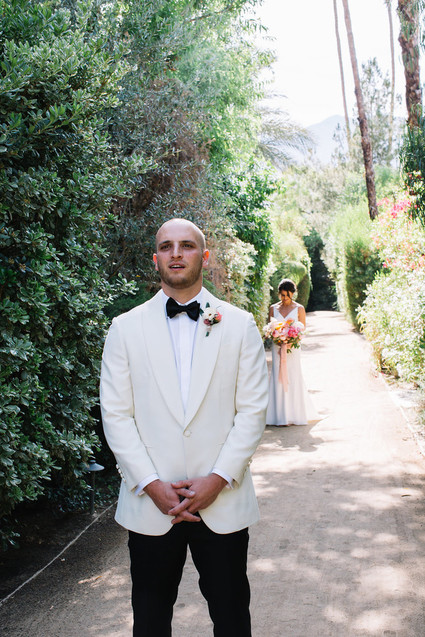 Groom in white tux jacket