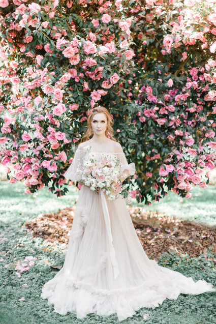 A stunning bridal editorial with a giant pink camellia tree
