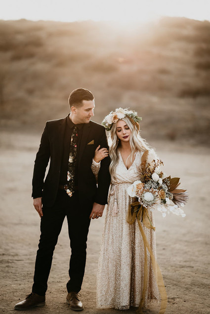 Boho vow renewal with a palm frond teepee at Wolf Feather Honey Farm