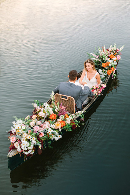 wedding portrait in a floral canoe