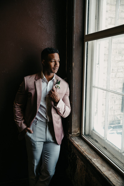 Fashion-forward groom style with a mauve jacket
