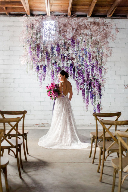 Bright moody spring wedding inspo with a dramatic floral curtain