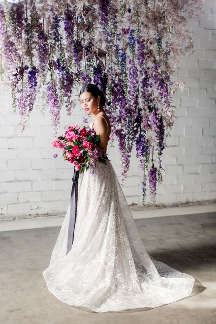 Bright moody spring wedding inspo with a dramatic floral curtain