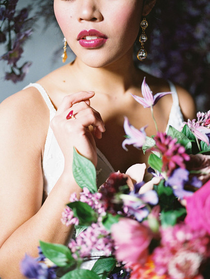 Bright moody spring wedding inspo with a dramatic floral curtain