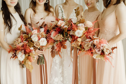 Tropical fall wedding in Thailand with rust and peachy accents