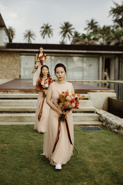 Tropical fall wedding in Thailand with rust and peachy accents