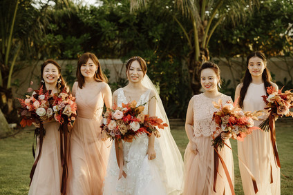 Tropical fall wedding in Thailand with rust and peachy accents