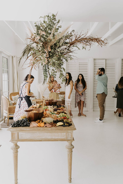 All white olive branch bridal shower with an epic grazing table