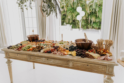 All white olive branch bridal shower with an epic grazing table